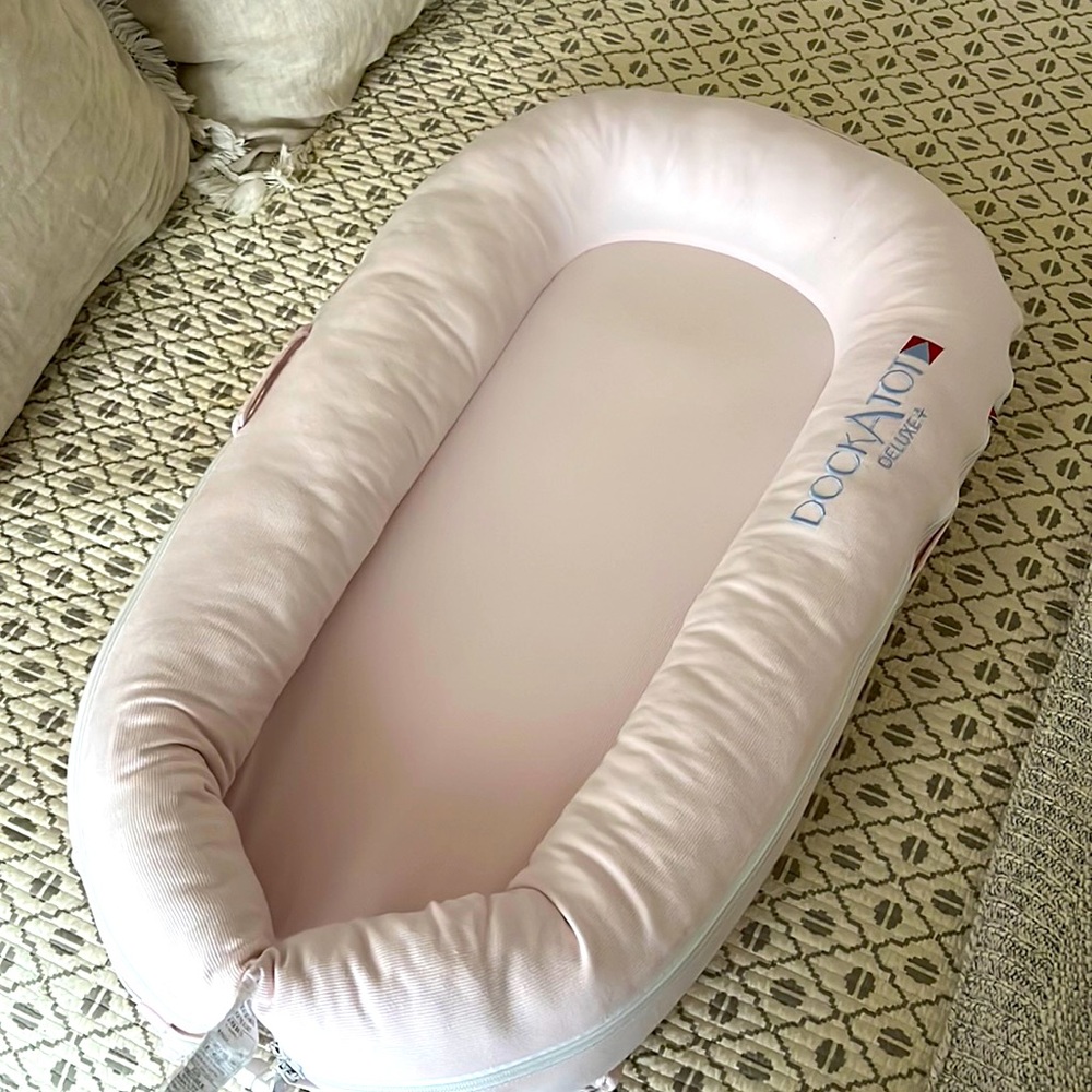 Excellent condition pale pink dock-a-tot